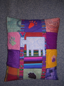 Coussin : Coussin en patchwork d'inspiration africaine. - 